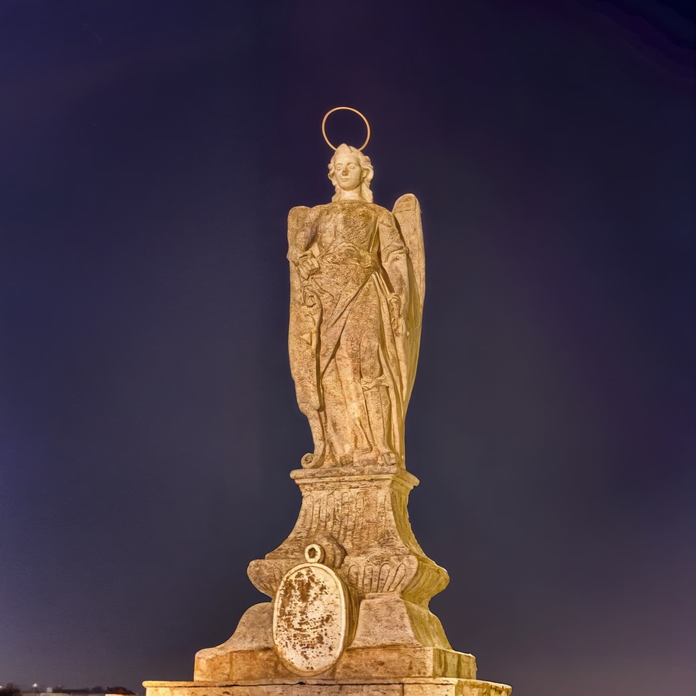 Kaash cover art — a haloed stone statue against a deep indigo night sky